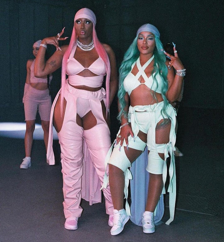 Stefflon Don and Ms Banks wearing custom mint green Jordan 1 Mid sneakers for a music video.