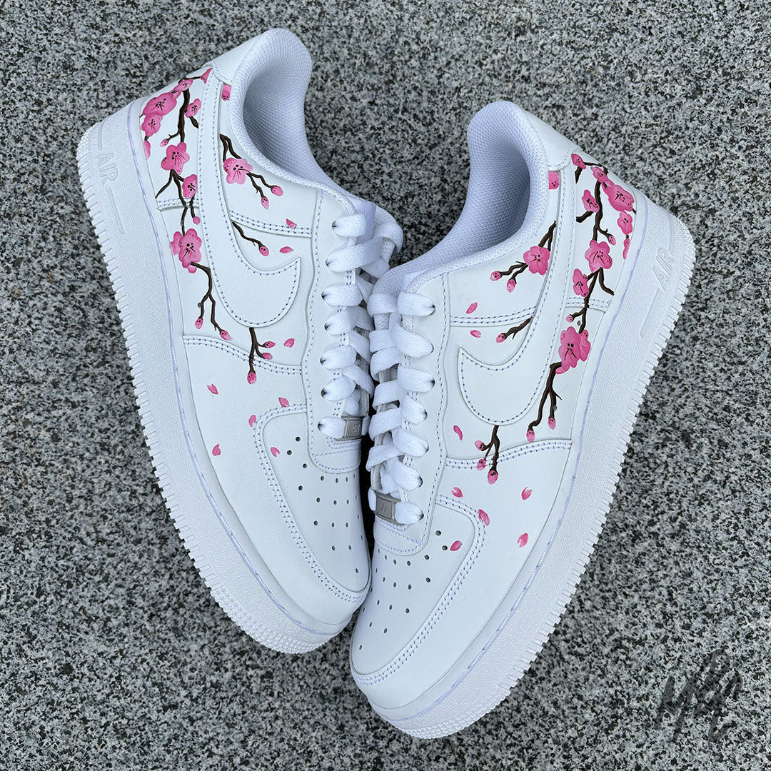 White AF1 with Japanese blossom tree painted onto the side of the trainers