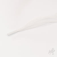 Close-up of a sheer white fishtail ribbon shoelace with a clear plastic aglet on a white background.