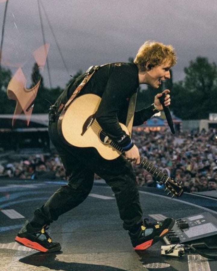 Ed Sheeran wearing custom sneakers on stage at his mathematics tour