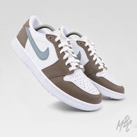 Pair of Fairway Fog Jordan 1 Low Golf custom golf shoes in taupe, white and light blue with premium leather construction