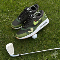 Nike Air Max 1 Fairway Camo custom golf shoes on course with golf ball and clubs, camouflage colourway