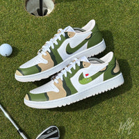 Custom Fairway Camo Jordan 1 Low Golf trainers on the putting green beside a golf hole and golf club