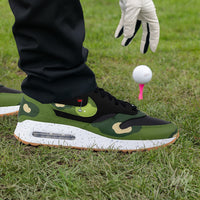 Custom Nike Air Max 1 Golf fairway camo sneaker worn on course, golf shoe with camo design in play setting