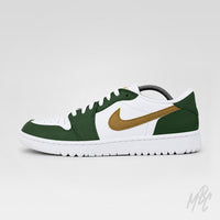 Side profile of a white Air Jordan 1 Low Golf shoe with dark green overlays, a metallic gold Nike Swoosh, white laces, and a white sole on a light gray background.