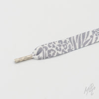 Grey and white animal print sneaker laces featuring leopard and zebra patterns for custom trainers and fashion footwear