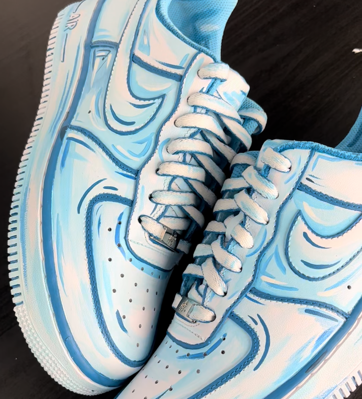 custom nike air force 1 sneakers with ice cube design hand painted to make the shoe look like it is frozen for a JD Christmas campaign
