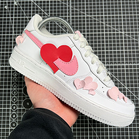 custom air force 1 trainers with 3D hearts cut, glued and sewn to the shoe