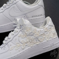 Side profile of white Air Force 1 custom with hand-applied lace embroidery across the leather upper and wedding date personalisation