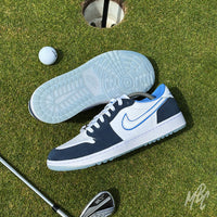 Navy Suede Jordan 1 Low Golf custom golf trainers on a putting green showing outsole traction beside a golf ball