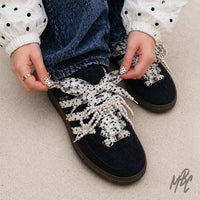 Custom adidas Spezial polka dot trainers with pearl lace detailing and ribbon bows, on-foot styling close-up