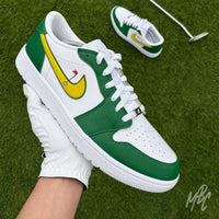 Nike Air Jordan 1 Low Golf Putting Greens 2.0 custom golf sneakers held on putting green with yellow swoosh detail