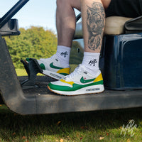 Putting Green Nike Air Max 1 Golf Custom Golf Sneakers in white in Golf Buggy on Golf Course