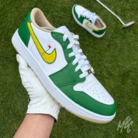 Nike Air Jordan 1 Low Golf Putting Greens 2.0 custom golf sneakers held on putting green with yellow swoosh detail