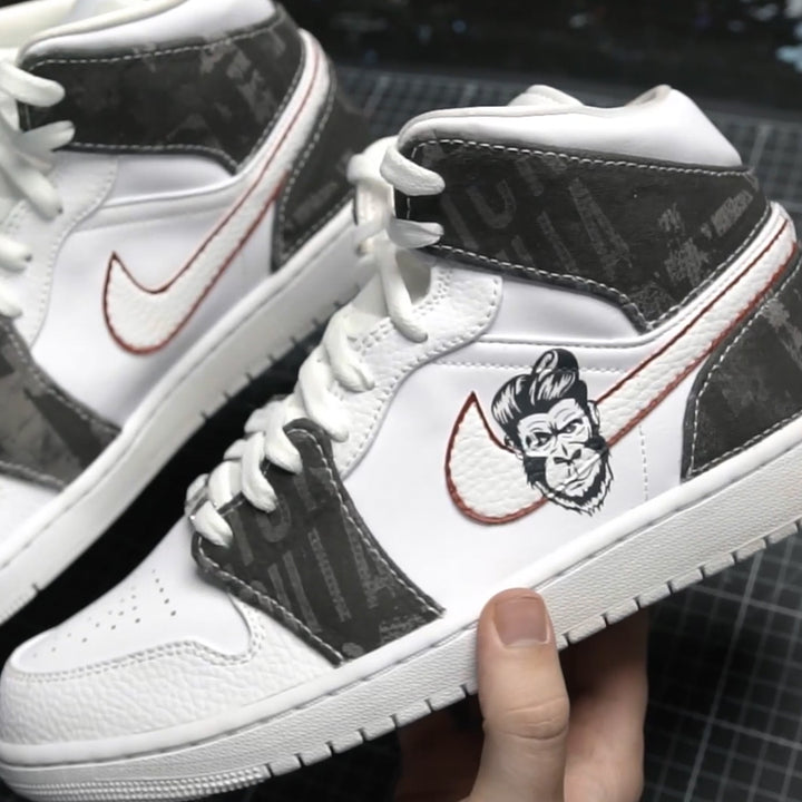 Hand crafted custom Jordan 1 Mid trainers with Slick Gorilla logo and branding