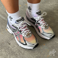 Pair of Sunset Dip Dye ASICS GT-2160 custom running trainers showcasing a hand-painted sunset gradient from yellow and orange through pink to purple on the mesh upper.
