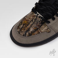 Woodland Camo Jordan 1 Low custom with brown suede overlays and woodland camo toe box detail