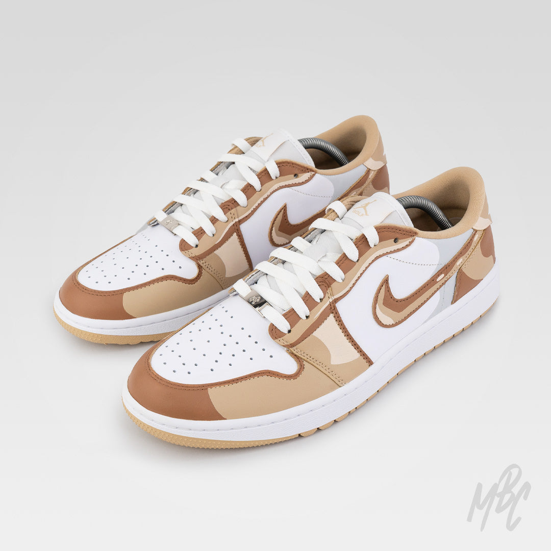 2D Illustration custom Jordan 1 Low Golf shoes featuring hand-painted beige and brown camouflage artwork with cartoon-inspired outlined detailing