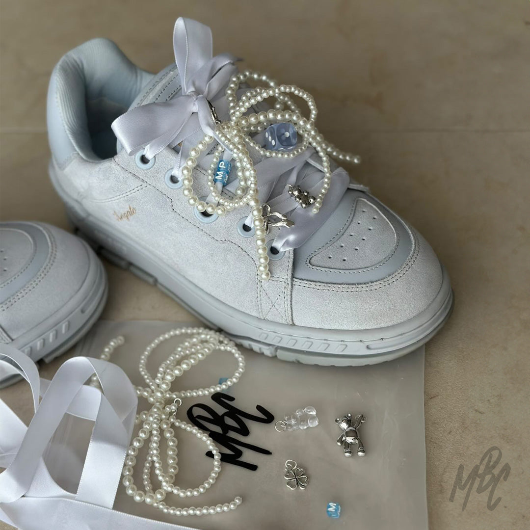 Arigato sneaker with lace charms and pearl bow