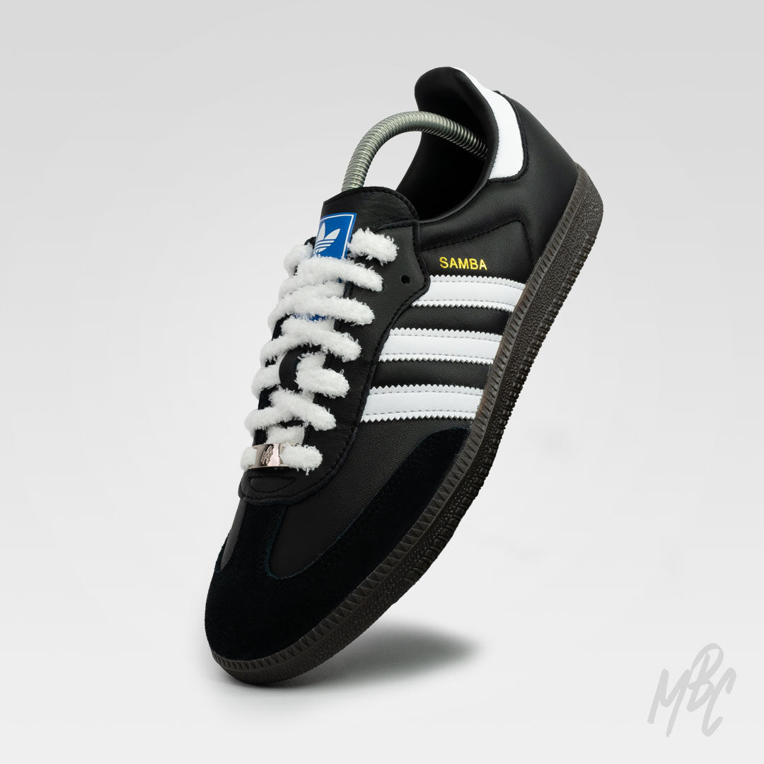 Black Adidas Samba custom sneakers with white fluffy laces