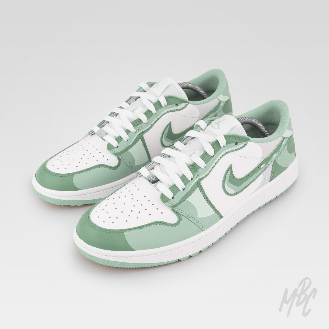 2D Illustration custom Jordan 1 Low Golf shoes featuring hand-painted beige and brown camouflage artwork with cartoon-inspired outlined detailing