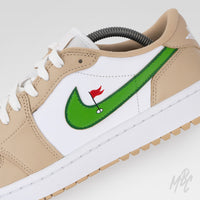 Close-up of Clean on the Green 2.0 Jordan 1 Low Golf sneaker featuring hand-painted green Swoosh with golf flag and hole artwork