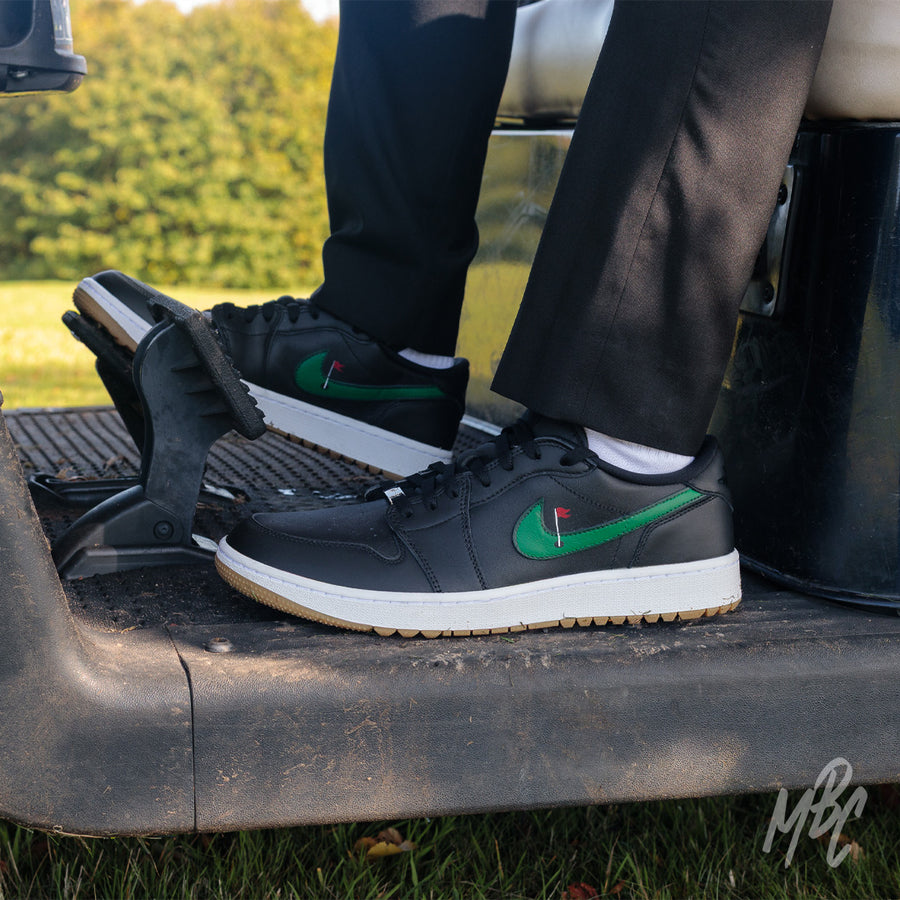 Clean on the Green Nike Jordan 1 Low Golf Custom Golf Sneakers in Black in Golf Buggy on Golf Course