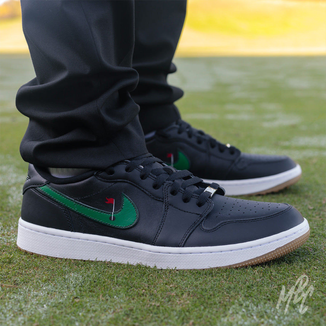 Clean on the Green Nike Jordan 1 Low Golf Custom Golf Sneakers in black on Golf Course Putting Green