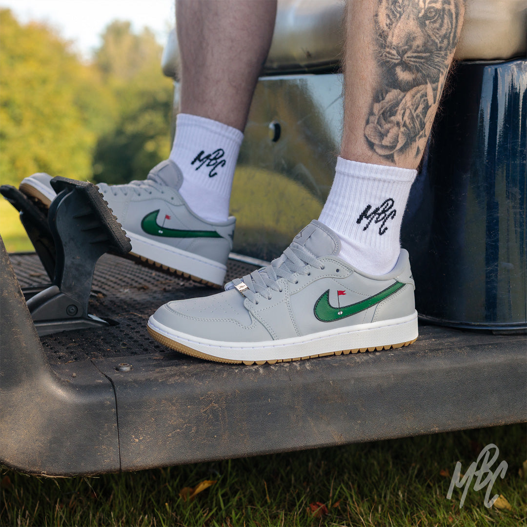 Clean on the Green Nike Jordan 1 Low Golf Custom Sneakers in grey in Golf buggy on Golf course