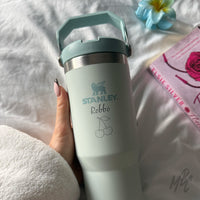 Custom Engraved Stanley IceFlow Flip Straw on bed. Clean girl bedside essentials. Custom drinkware gift with name engraving for lifestyle or corporate use.
