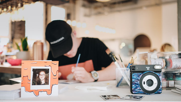hand painting polaroid film live at a fujifilm activation