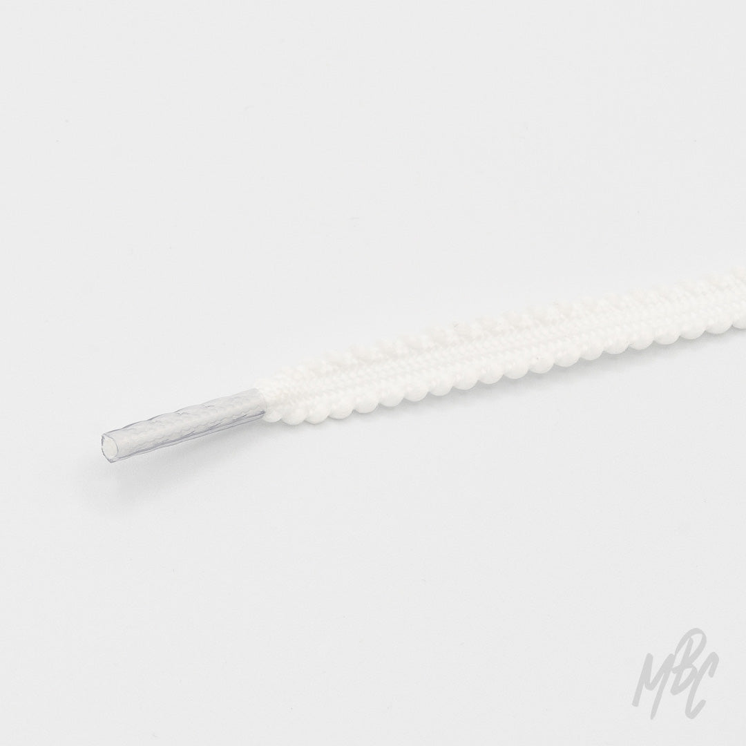 White textured sneaker laces with scalloped edge design for custom trainers and unique sneaker customisation