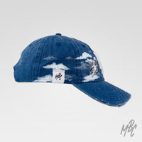 Blue denim New Era NY custom cap with angel artwork, cloud detailing and side profile view