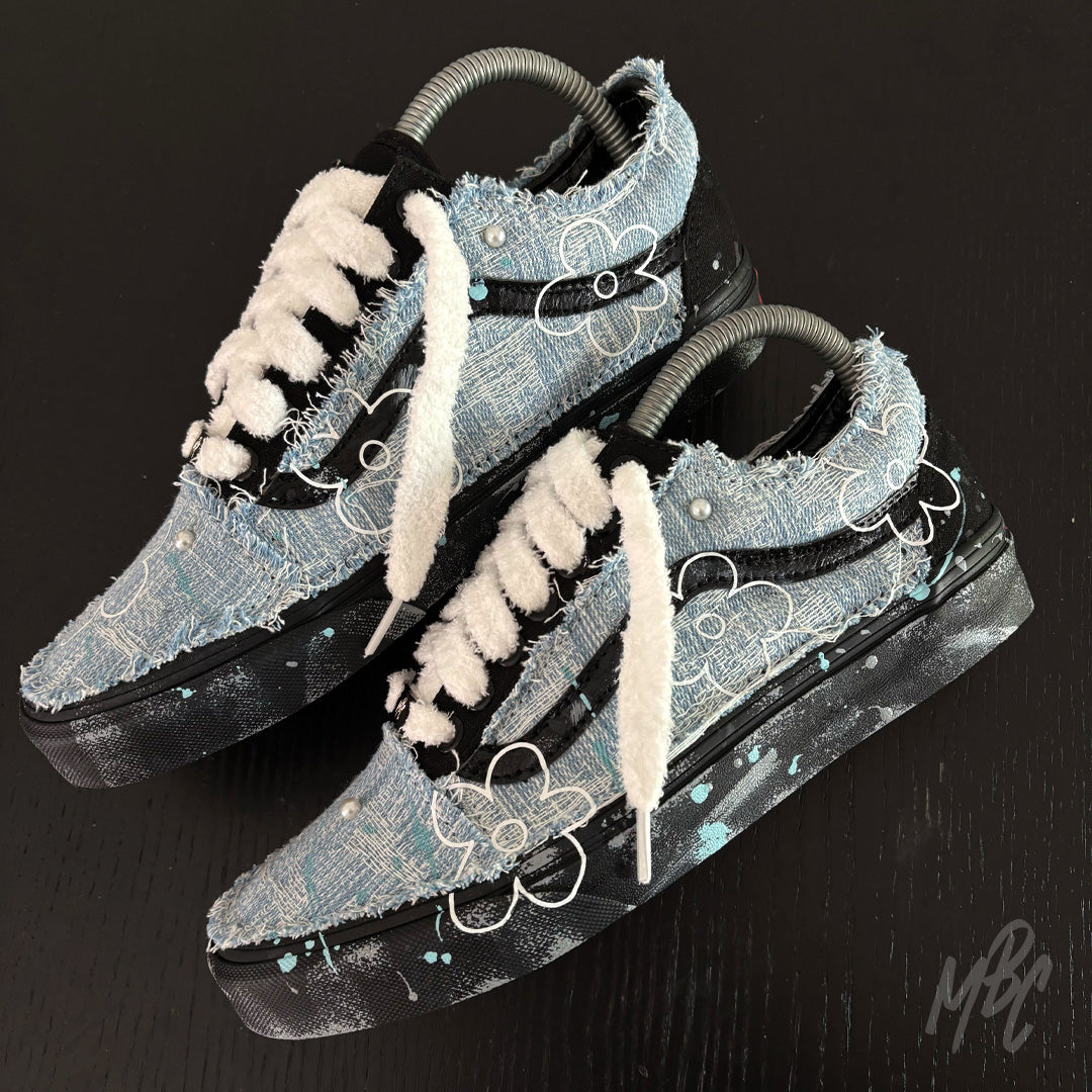 Custom Denim Bloom Vans Old Skool trainers featuring distressed denim uppers, white floral graphics, pearl details and fluffy white laces.