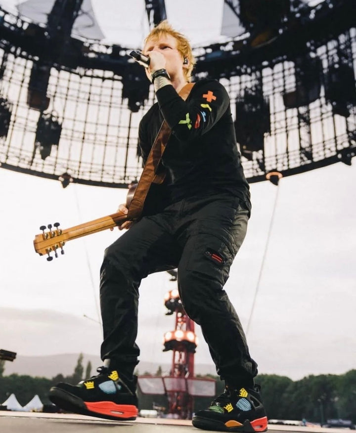 Ed Sheeran wearing custom Nike Jordan 4's on his mathematics tour