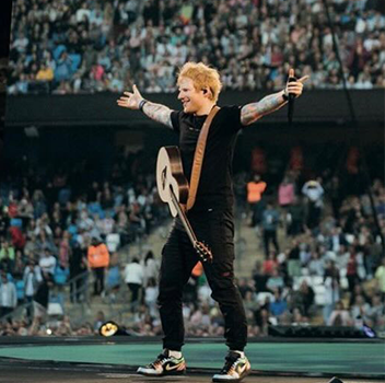 Ed Sheeran wearing custom Jordan 1 Low trainers with mathematics tour symbols hand painted on