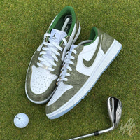 Top-down view of Emerald Reserve Jordan 1 Low Golf custom golf shoes on a putting green with golf ball and iron club