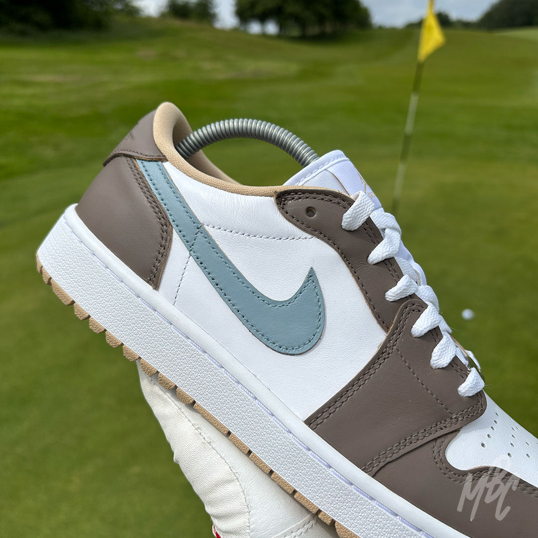 Close-up of the Fairway Fog Jordan 1 Low Golf custom golf trainer featuring taupe and light blue colour blocking