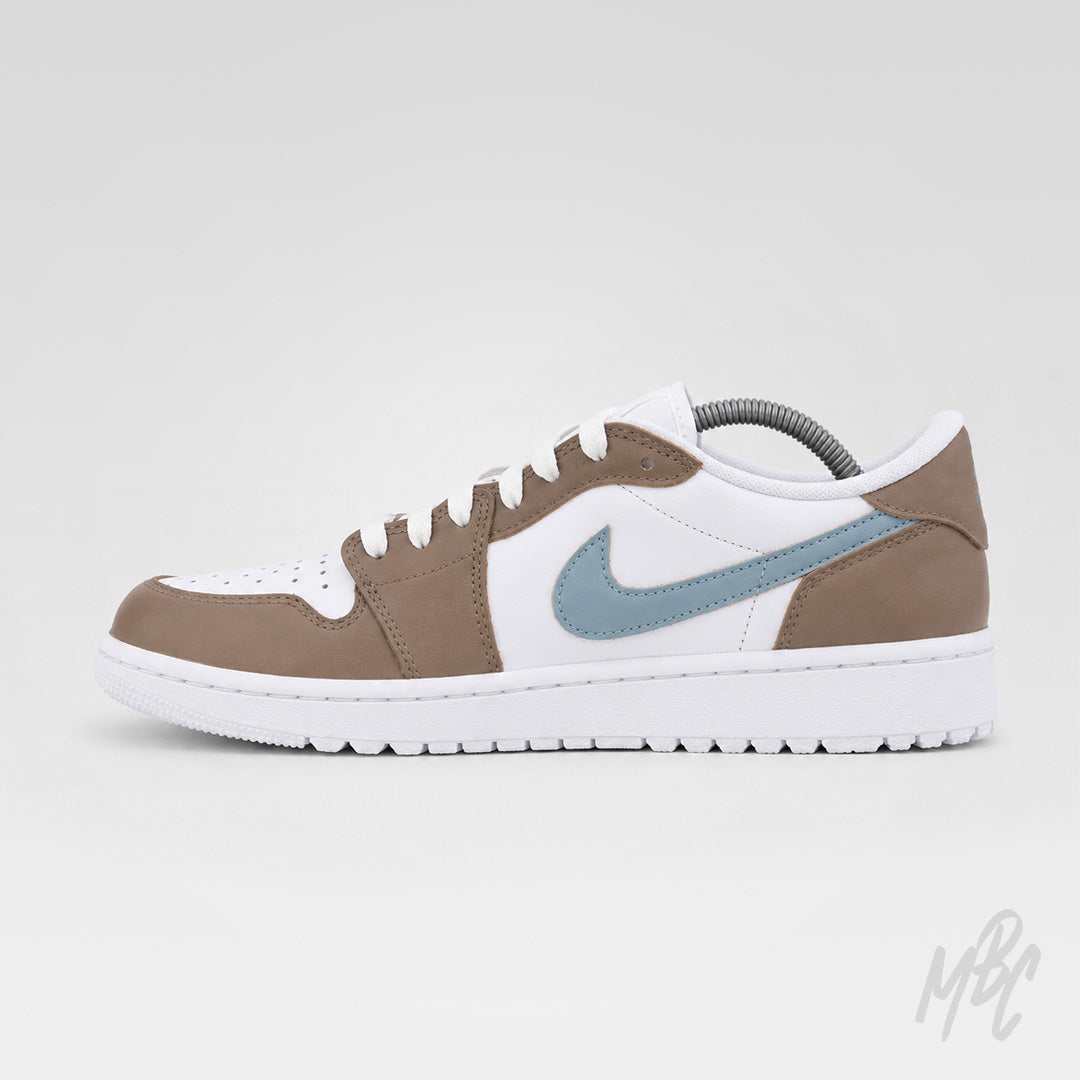 Side profile of Fairway Fog Jordan 1 Low Golf custom golf shoe with premium taupe and white colourway, blue Swoosh and golf outsole