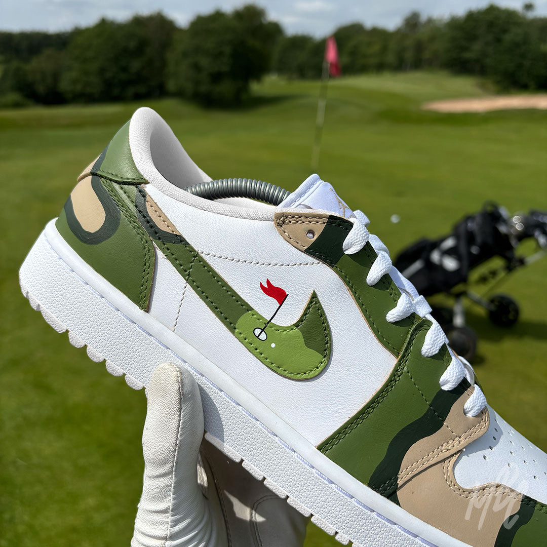 Close-up of the Fairway Camo Jordan 1 Low Golf custom golf shoe featuring a golf flag detail on the swoosh