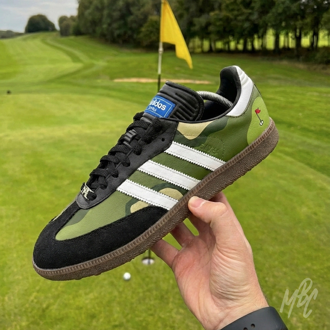 Custom Adidas Samba Golf Black Sneakers by MattB Customs. Fairway Camo customised with green, dark green and beige sand colourway with hand painted flag detail. Custom Adidas Samba golf sneakers on golf course putting green