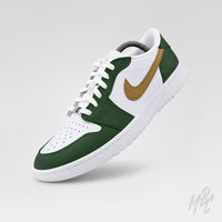 Angled front view of a white Air Jordan 1 Low Golf shoe with dark green overlays, a metallic gold Nike Swoosh, white laces, a perforated toe box, and a white sole on a light gray background.