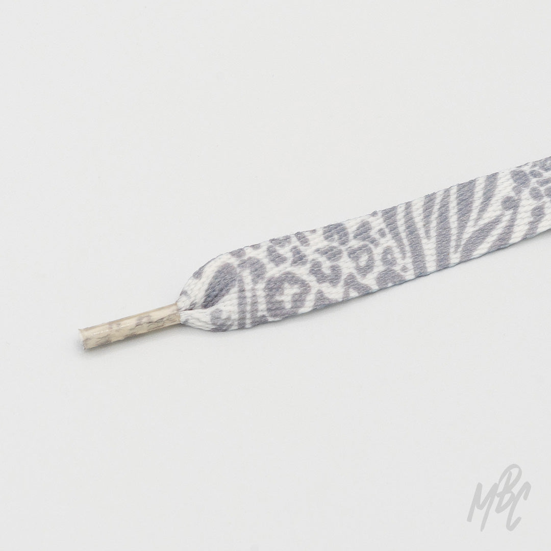 Grey and white animal print sneaker laces featuring leopard and zebra patterns for custom trainers and fashion footwear