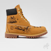 Side profile of a tan Timberland 6 Inch boot with permanent cherub artwork engraved directly into the suede