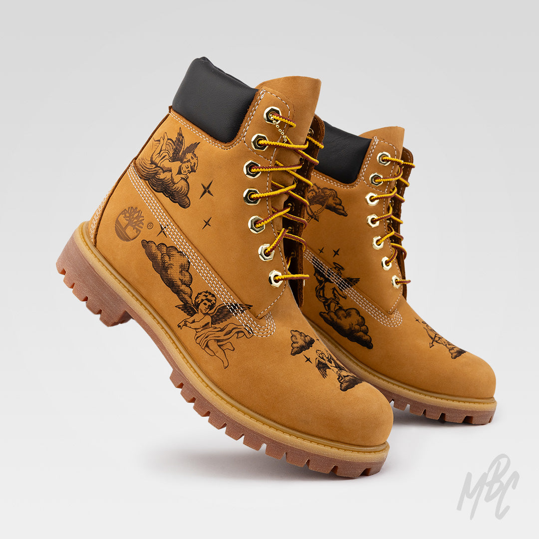 Hand-crafted Timberland 6 Inch boots with engraved cherub artwork, created using pyrography for a clean etched finish