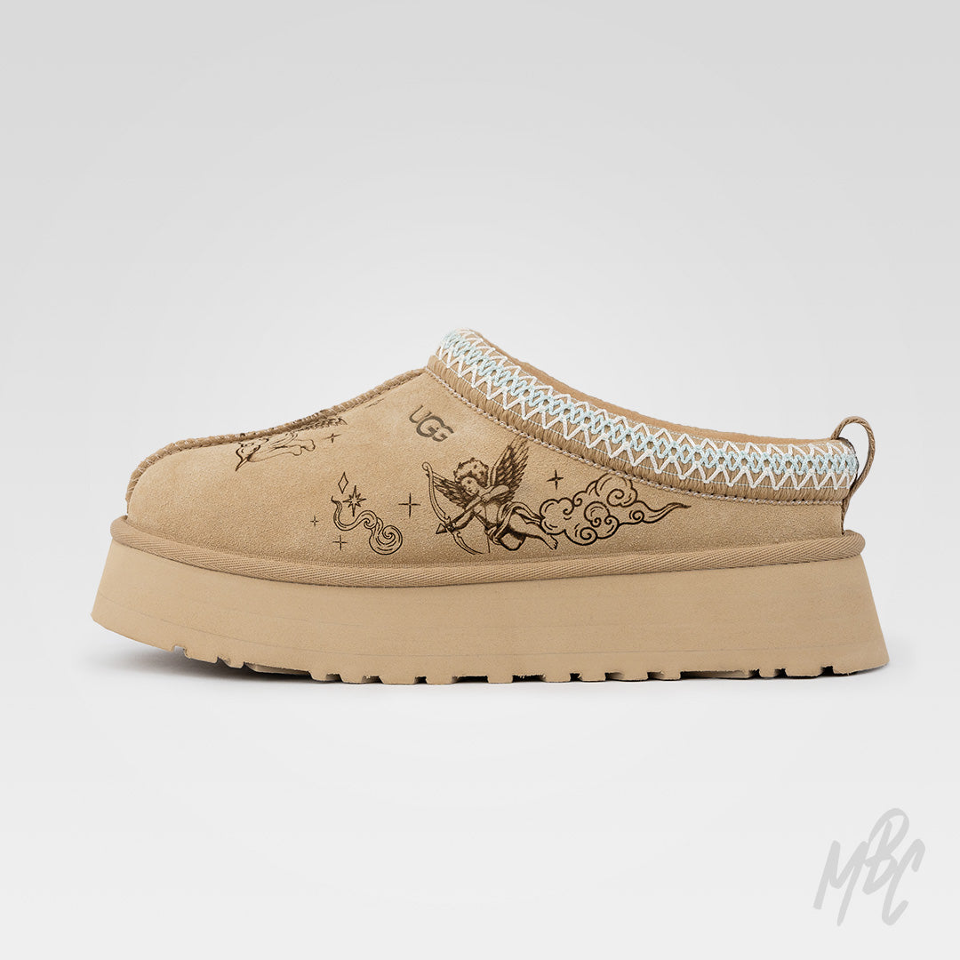 Side profile of the Heaven Etched UGG Tazz II custom featuring tattoo-inspired cherub artwork engraved into suede