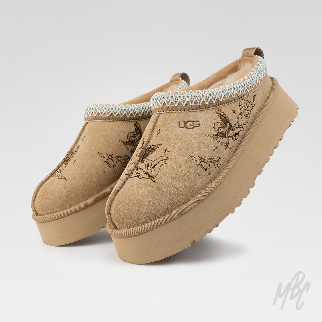 Custom UGG Tazz II slippers engraved with floating cherub artwork, digitally illustrated and etched directly into suede