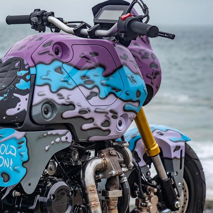 Customised Honda Bike with dripping lilac, blue and purple paint