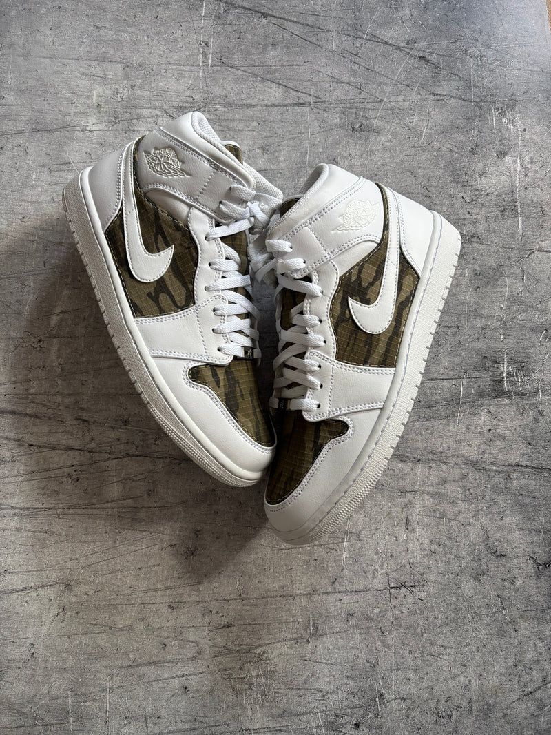 Custom Jordan 1 Mid sneakers with camouflage fabric panels and bespoke material customisation