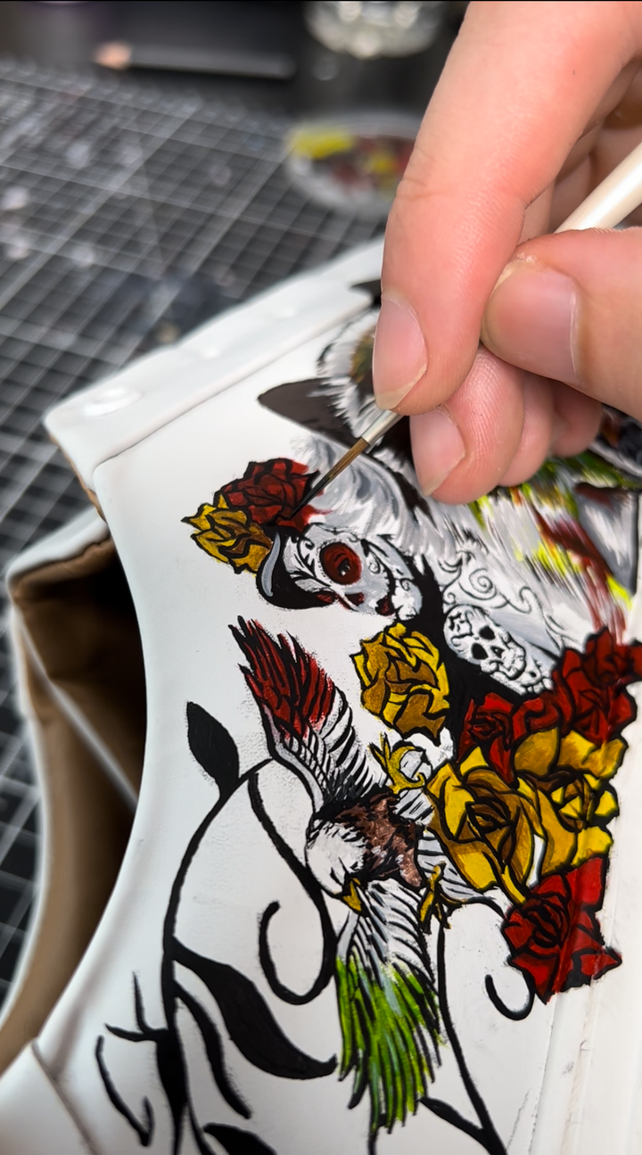 hand painting the Sony Entertainment custom trainers with artwork made for the release of the Bullet Train film with our design reflecting characteristics of the Bad Bunny character
